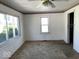 Bright bedroom with large windows and a view of the yard at 3209 Mounds Rd, Anderson, IN 46016