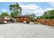 Spacious backyard area with gravel, playground, and seating area at 3302 N Gladstone Ave, Indianapolis, IN 46218