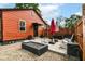 Backyard patio with a fire pit, seating and privacy fence at 3302 N Gladstone Ave, Indianapolis, IN 46218