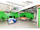Finished basement space with painted walls and open ceiling at 3302 N Gladstone Ave, Indianapolis, IN 46218
