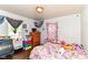 This bedroom has a window, furniture, and decor at 3302 N Gladstone Ave, Indianapolis, IN 46218