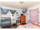This bedroom has a window, furniture, and decor at 3302 N Gladstone Ave, Indianapolis, IN 46218