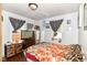 Comfortable bedroom with natural light from two windows and closet space at 3302 N Gladstone Ave, Indianapolis, IN 46218