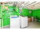 Finished basement laundry area with side-by-side washer and dryer at 3302 N Gladstone Ave, Indianapolis, IN 46218