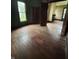 Spacious living room with original hardwood floors and plenty of natural light at 350 Johnson Ave, Franklin, IN 46131