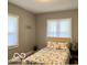 Bright bedroom featuring neutral walls, ample natural light, and a comfortable bed at 36 N Ewing St, Indianapolis, IN 46201