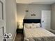 Comfortable bedroom with a stylish bed, soft lighting, and neutral décor at 36 N Ewing St, Indianapolis, IN 46201