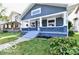 Attractive home with a covered front porch and updated exterior design at 36 N Ewing St, Indianapolis, IN 46201
