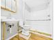 This bathroom has a new vanity, a toilet and a shower with wood-look flooring at 3631 Columbus Ave, Anderson, IN 46013