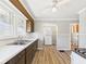 Kitchen with white refrigerator, light countertops, vinyl flooring, and wood cabinets at 3631 Columbus Ave, Anderson, IN 46013