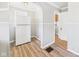 View of the kitchen featuring a white refrigerator and arched doorway at 3631 Columbus Ave, Anderson, IN 46013