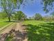 The property has a large backyard with lots of grass and mature trees at 3631 Columbus Ave, Anderson, IN 46013