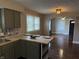 Updated kitchen boasts stylish cabinets, butcher block countertops, and hardwood floors at 3720 W 16Th St, Indianapolis, IN 46222
