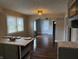 Eat-in kitchen with updated cabinets, stylish countertops, and hardwood floors at 3720 W 16Th St, Indianapolis, IN 46222