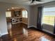 Open-concept living room with hardwood floors and an archway leading to the kitchen at 3720 W 16Th St, Indianapolis, IN 46222