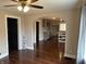 Open-concept living area showcases hardwood floors, and an archway leading to kitchen at 3720 W 16Th St, Indianapolis, IN 46222