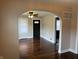 Living room with beautiful archway, ceiling fan, and hardwood floors at 3720 W 16Th St, Indianapolis, IN 46222