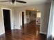 Spacious living area boasts hardwood floors and an archway leading to the kitchen at 3720 W 16Th St, Indianapolis, IN 46222