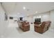 Finished basement with neutral walls, leather furniture, and bar area at 3743 Earhart Dr, Carmel, IN 46074