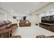 Finished basement featuring neutral walls, carpet, leather furniture and bar at 3743 Earhart Dr, Carmel, IN 46074