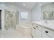 Spacious bathroom featuring a soaking tub, glass shower, tile flooring and vanity at 3743 Earhart Dr, Carmel, IN 46074