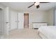 Neutral bedroom featuring ceiling fan, connected bathroom, and plenty of natural light at 3743 Earhart Dr, Carmel, IN 46074