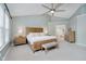 Comfortable bedroom with light blue walls, king size bed, and matching night stands at 3743 Earhart Dr, Carmel, IN 46074
