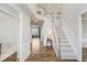 Spacious foyer with hardwood floors, a staircase, and an abundance of natural light at 3743 Earhart Dr, Carmel, IN 46074