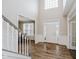Spacious foyer with hardwood floors, a staircase, and an abundance of natural light at 3743 Earhart Dr, Carmel, IN 46074
