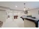 Basement game room boasts a pool table, bar area, neutral decor, and great lighting at 3743 Earhart Dr, Carmel, IN 46074