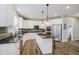 Modern kitchen with stainless appliances, granite countertops and ample cabinet space at 3743 Earhart Dr, Carmel, IN 46074
