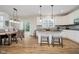 Beautiful kitchen with stainless appliances, granite countertops, and a view into dining area at 3743 Earhart Dr, Carmel, IN 46074
