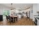 Bright eat-in kitchen with stainless steel appliances, granite countertops, and modern cabinetry at 3743 Earhart Dr, Carmel, IN 46074