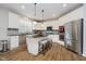 Kitchen features stainless steel appliances, granite countertops, and large center island at 3743 Earhart Dr, Carmel, IN 46074