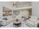 This spacious living room has a two-story view, carpet and a large comfortable leather couch at 3743 Earhart Dr, Carmel, IN 46074
