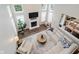 Overhead view of a modern living room with fireplace, area rug, and plenty of natural light at 3743 Earhart Dr, Carmel, IN 46074