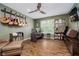 Inviting office features a guitar display, shelving, a modern desk, and a comfortable chair at 3743 Earhart Dr, Carmel, IN 46074