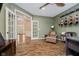 Spacious office with guitars, hardwood floors, French doors and natural light at 3743 Earhart Dr, Carmel, IN 46074