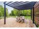 Outdoor living space features a patio with a pergola and outdoor dining furniture at 3743 Earhart Dr, Carmel, IN 46074