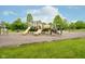 Outdoor community playground featuring slides, climbing equipment, and swings on a well maintained and manicured lawn at 3743 Earhart Dr, Carmel, IN 46074