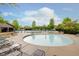 This splash pool has deck furniture surrounding it, perfect for a relaxing afternoon for residents and guests at 3743 Earhart Dr, Carmel, IN 46074