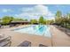 Large swimming pool and deck area offers a relaxing retreat for residents and guests on a sunny day at 3743 Earhart Dr, Carmel, IN 46074