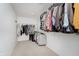 Spacious walk-in closet with ample shelving and hanging storage for clothes and shoes at 3743 Earhart Dr, Carmel, IN 46074