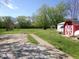 Spacious backyard featuring a shed, concrete patio, and ample green space at , Plainfield, IN 46168