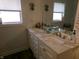Bathroom featuring a modern vanity with dual sinks and updated fixtures at , Plainfield, IN 46168