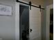 Bathroom behind sliding barn door featuring updated fixtures and ample space at , Plainfield, IN 46168