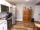 A well-equipped kitchen with stainless steel appliances, wood-look floors, and unique decor at , Plainfield, IN 46168