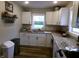 Bright kitchen featuring white cabinetry, granite countertops, and modern fixtures at , Plainfield, IN 46168