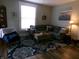 Comfortable living room featuring a plush couch, area rug, and hardwood style floors at , Plainfield, IN 46168