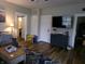 Inviting living room featuring hardwood floors, modern TV and comfortable seating at , Plainfield, IN 46168
